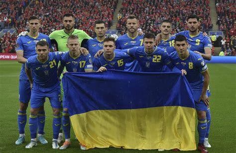 Ukraine soccer gifted flag by soldiers before World Cup qualifier