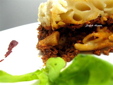 A Close Up Of Food On A Plate With Green Leafy Garnishes