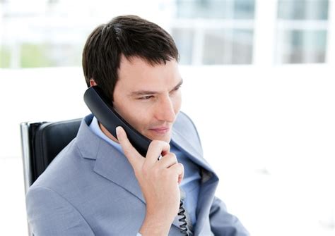 Premium Photo Charming Young Businessman Talking On Phone