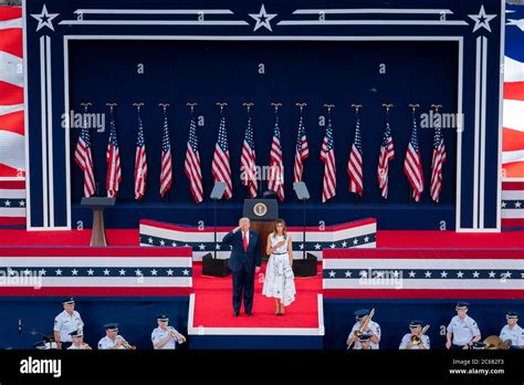 U S President Donald Trump And First Lady Melania Trump Stand For The