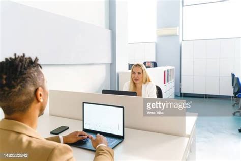 Person Behind Desk On White Photos And Premium High Res Pictures