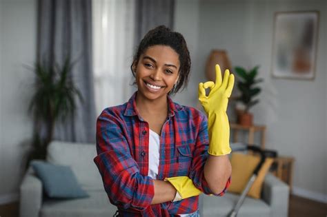 Premium Photo Glad Millennial Black Lady In Rubber Gloves Shows Ok