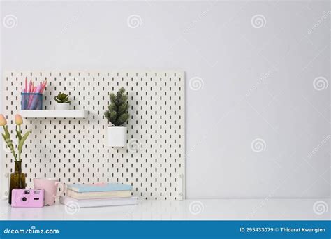 Stylish Desk Interior with White Table Background with Plant and Leaves ...