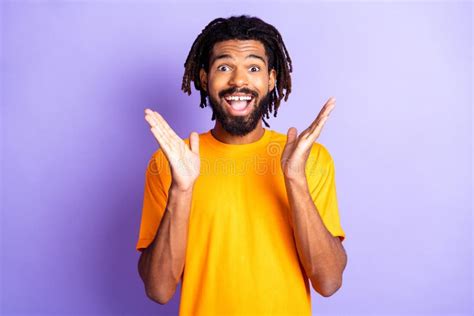 Portrait Of Nice Impressed Brunet Guy Arms Up Wear Orange T Shirt On