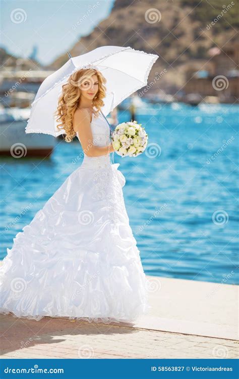 Beautiful Bride In Wedding Dress With White Umbrella Outdoors P Stock