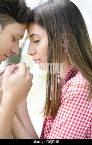 Couple praying together Stock Photo - Alamy