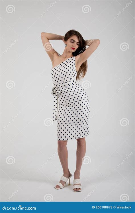 Stunning Model Posing In A White Polka Dot Dress Stock Image Image Of