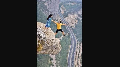 Fake Or Real Pic Of Couple Posing On Edge Of Cliff Leaves People With