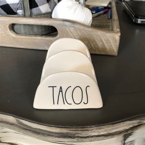 A Close Up Of A Taco Shaped Object On A Table With Other Items In The