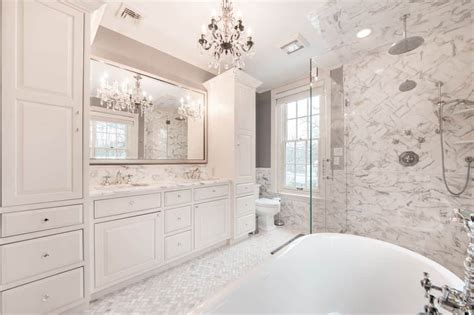 Luxurious White Bathroom With A Dual Sink Vanity Topped With Gray