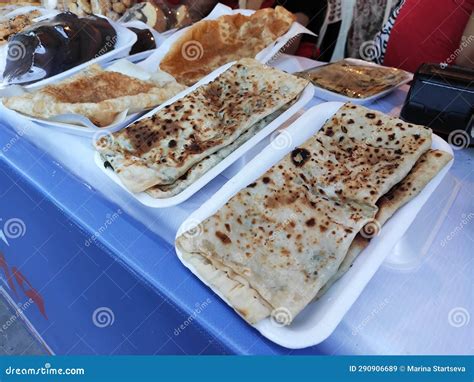 Traditional Turkish Fried Tortillas With Stuffing On Plate In A Shop