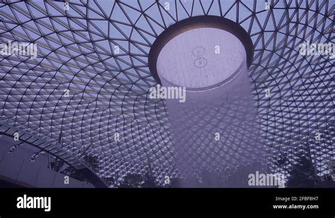 Jewel Changi Airport - Rain Vortex Stock Video Footage - Alamy