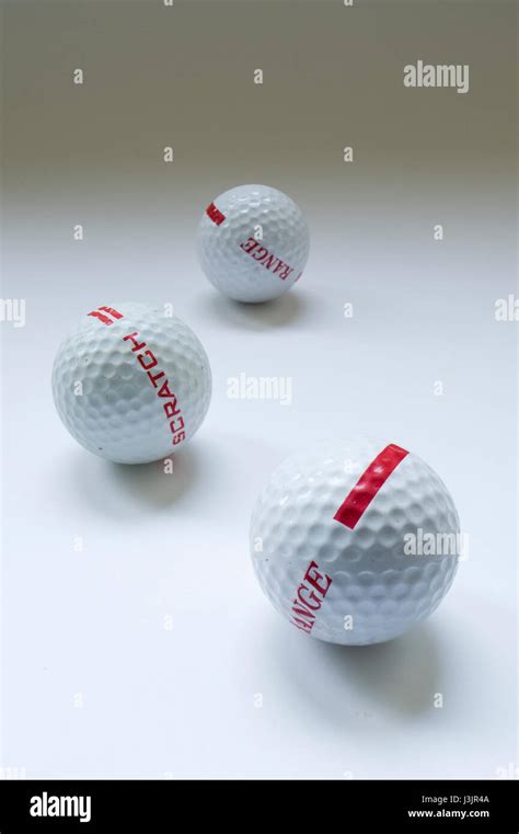 three golf balls Stock Photo - Alamy