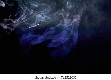 Blue Smoke Over Black Studio Background Stock Photo