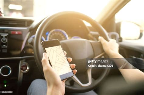 Female Driver Use Smartphone Nevigate Route For Travel Inside Eco Car