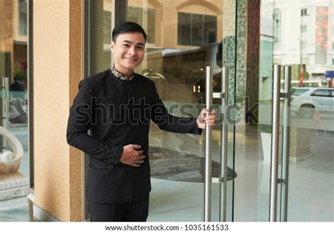 Smiling Doorman Standing Hotel Entrance Stock Photo Edit Now 1035161533