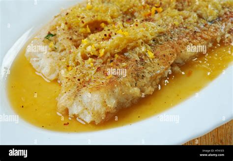 Grilled Monkfish In Orange Sauce Stock Photo Alamy