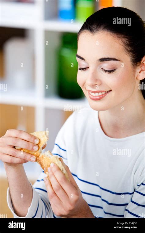 Woman Eating Bread Stock Photo Alamy