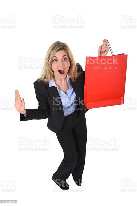 Young Beautiful Woman In Business Suit Holding Red Shopping Bag Stock