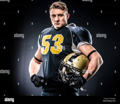 American Football Player Holding Helmet Stock Photo Alamy