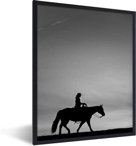 Fotolijst Incl Poster Zwart Wit Silhouet Van Een Cowboy Op Een Paard