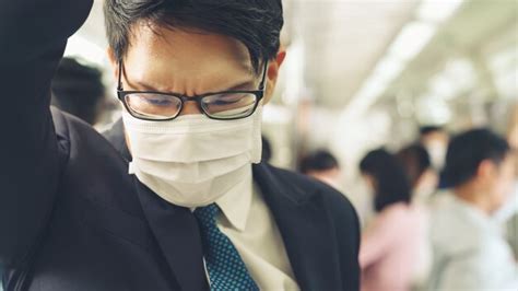 Premium Photo Young Man Wearing Face Mask Travels On Crowded Subway Train