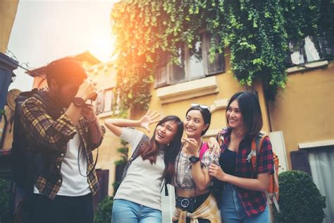 Free Photo Group Of Happy Friends Taking Selfies Together In Urban Scene