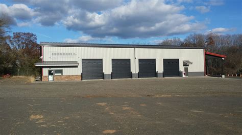 Heavy Duty Prefab Steel Commercial Buildings With Truck Bays And Office