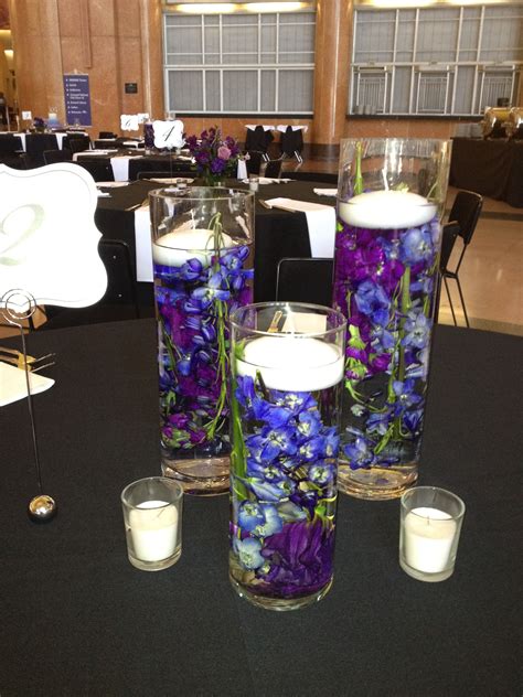 Purple Centerpiece Flower Petals In Water With Floating Candle With