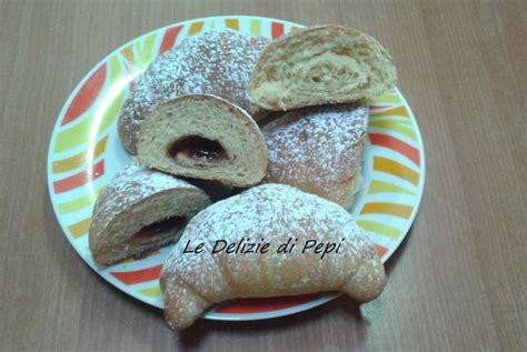 Some Powdered Pastries Are On A Plate With The Words Le Delizzi Di Pepi