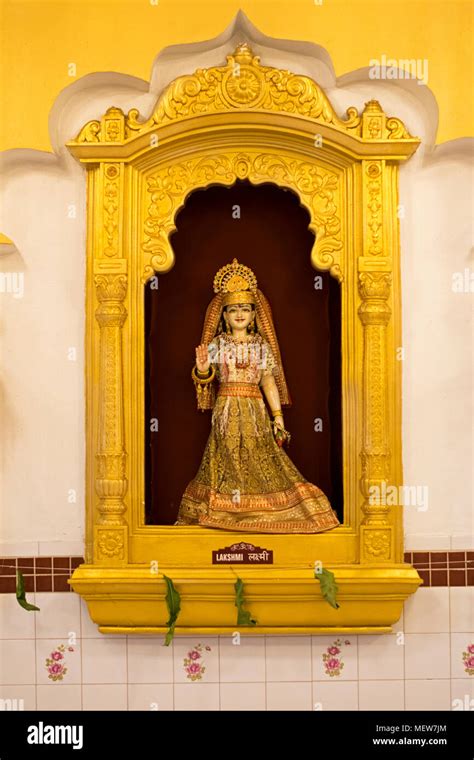 A Statue Of Lakshmi On The Wall At The Shri Lakshmi Narayan Mandir