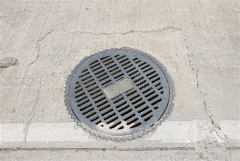 Metal Manhole Cover of the Drainage System Stock Photo - Image of ...