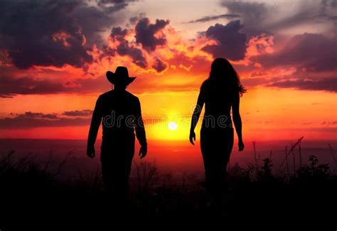 Romantic Sunset Stroll: Cowboy Couple Silhouette