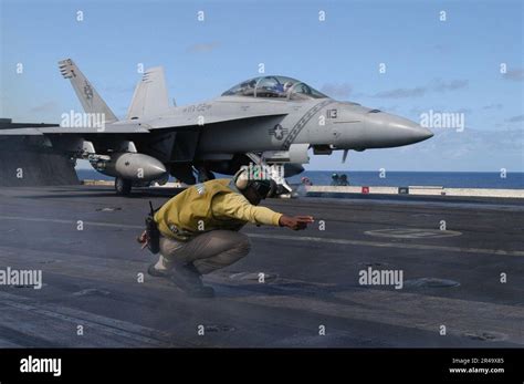 Us Navy A Catapult Officer Signals The Launch Of An F A F Super