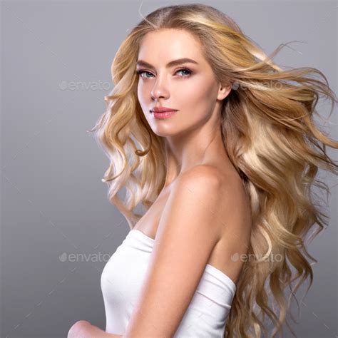 Long Blonde Curly Fly Hair Woman Portrait Stock Photo By Kiraliffe