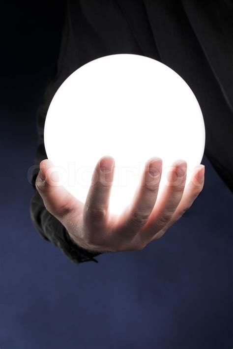 Man Holding A Glowing White Sphere In His Hand Stock Image Colourbox