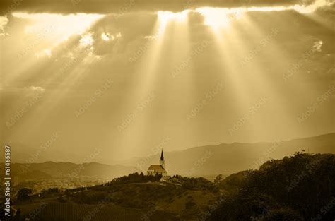 Sun rays shining down on a Church Stock Photo | Adobe Stock