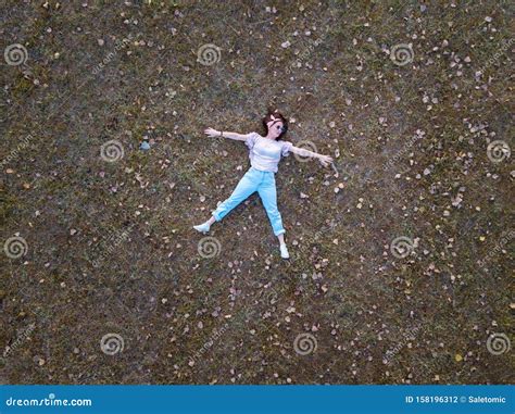 Cute Girl Lying in the Grass Aerial Stock Photo - Image of cheerful ...