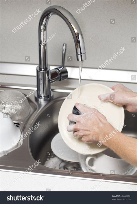 Woman Washing Dishes In The Kitchen Close Up Stock Photo 40655182