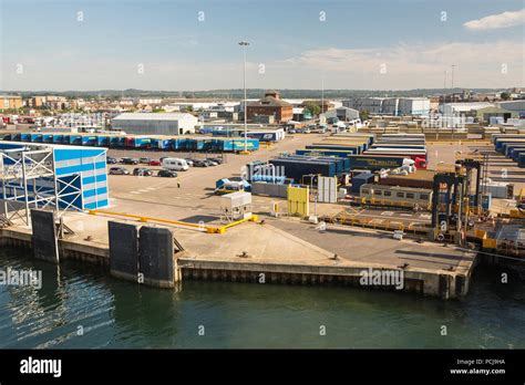 Poole Ferry Terminal With Lorries Parked Up And Passengers Queing For A