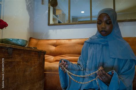 Muslim woman praying at home Stock Photo | Adobe Stock