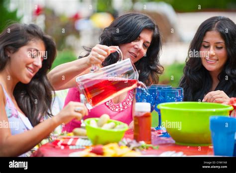 Family eating together outdoors Stock Photo - Alamy