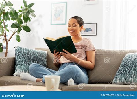 Happy African American Woman Reading Book At Home Stock Image Image