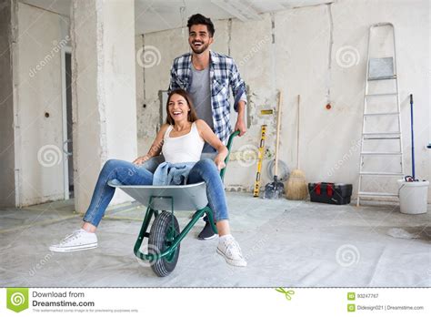 Loving Couple Is Having Fun While They Are Renovating House Stock Image Image Of Happy Ladder