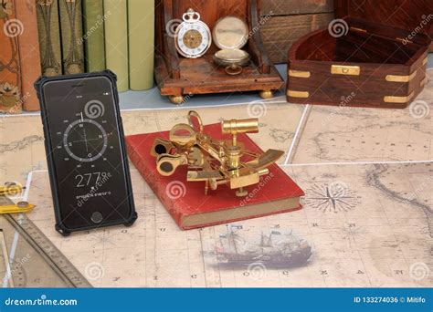 Old And Modern Navigation Nautical Chart Sextant And Mobile Ph Stock