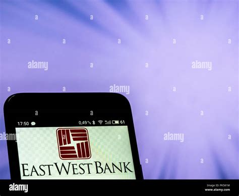 East West Bank logo seen displayed on a smart phone Stock Photo - Alamy