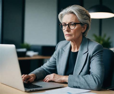 Premium Photo A Woman Sits At A Desk With A Laptop And A Paper On The