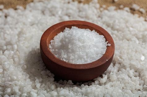 Premium Photo White Salt In A Wooden Bowl