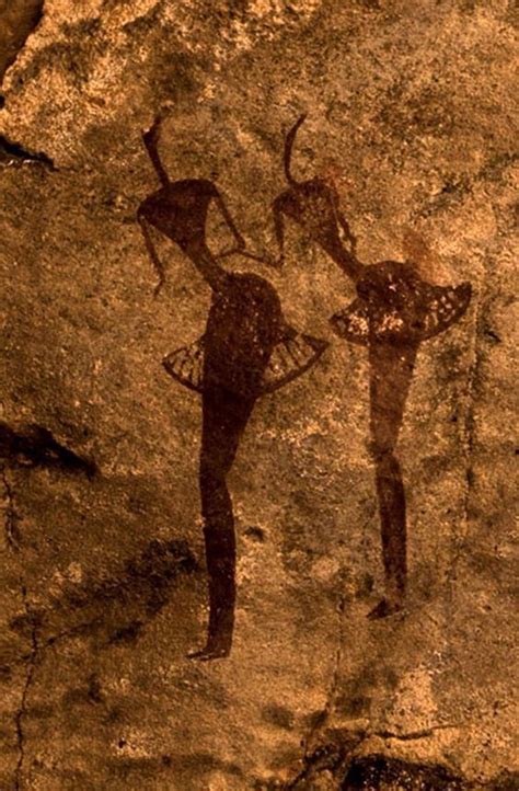 An Image Of Two People On A Rock