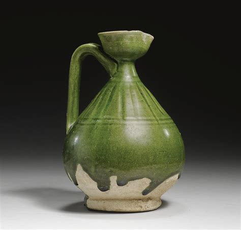 272 A Fatimid Green Glazed Sgraffiato Jug Egypt 11th 12th Century